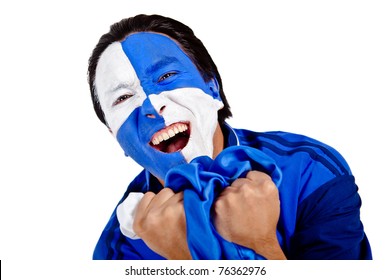 Football Fan With A Blue And White Flag Painted On His Face Screaming