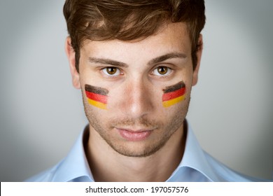 Football Fan With Germany Flag Painted At The Face 