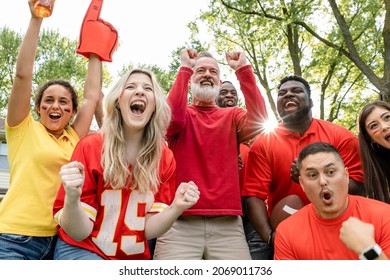 Football fans celebrating the win of their team at a tailgate party
