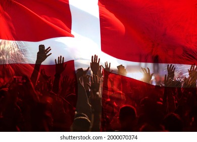 Football Fans Supporting Denmark - Crowd Celebrating In Stadium With Raised Hands Against Danish Flag