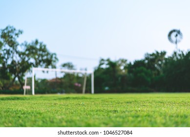 Football field, Goal with blue sky, Selective focus, blurred - Powered by Shutterstock