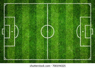 Football field or image of natural green grass soccer field. top view background - Shutterstock ID 700194325