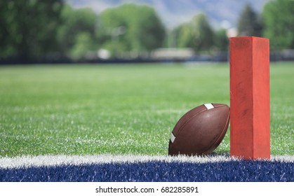 Football Field Low End Zone View. Selective Focus Photo Of The Pylon And Touchdown Line On A Football Field. Low Angle View From The End Zone