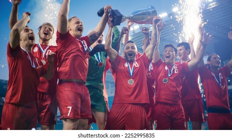 Football Finals Tournament Winning Team Celebrates Victory Cheering and Lifting Trophy Prize, Showing it to the Whole Stadium Arena. Happy Soccer Players Champions of International Championship Cup - Powered by Shutterstock