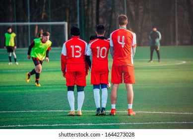 Football Free Kick, Soccer Concept Photo, Players In Red Jerseys, Green Grass Sunset Light