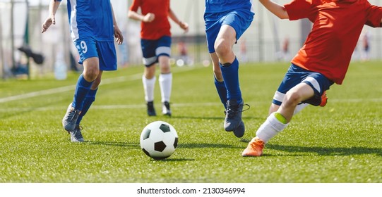 Football Game On Summer Sunny Day. Young Boys Compete In Tournament Match. School Kids Running Classic Soccer Ball On Grass Pitch