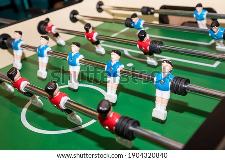 football game, Soccer table with red and blue players.dolls of a retro games.Football players miniatures from the kicker table game
