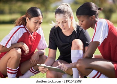 Football girls with a digital tablet checking fitness goal progress or online score on exercise app during practice on field. Sports or soccer player and coach looking at date or schedule on - Powered by Shutterstock