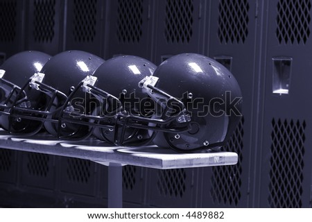football helmets in locker room