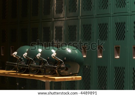 football helmets in locker room