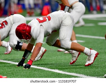 Football Linemen Rushing, Blocking And Tackling