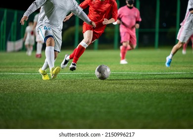 Football match on village. Two men are playing a game over a soccer ball. - Shutterstock ID 2150996217