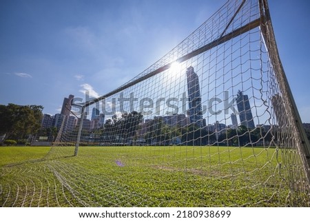 Football net in the court with sunlight flare