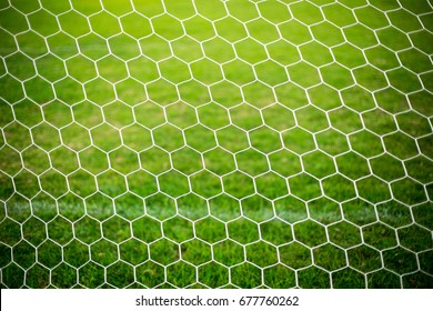 Football Net With Green Grass Background