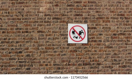 Football not allowed sign on the bricks                              - Powered by Shutterstock