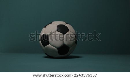 Football on dark blue background.