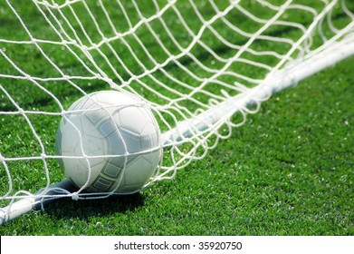 football on grass with net
