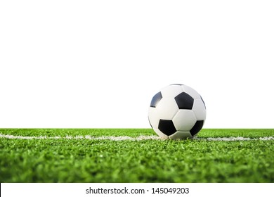 Football On Green Grass Isolated