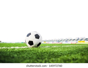 Football On Green Grass Isolated