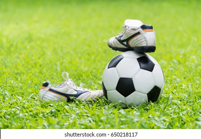 Football On Green Grass And Stud Shoe, Healthy Concept