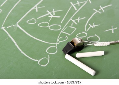 A Football Play Diagram Drawn With Chalk On A Chalkboard With Chalk And A Whistle