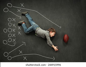 Football Playbook With Boy Diving For The Catch