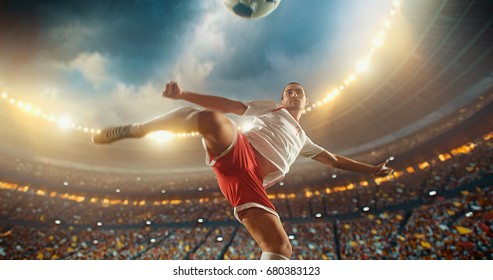 Football Player About To Kick Ball In The Air. The Stadium Is Full Of People Behind Him. Stadium Is Made In 3D With No Existing References.