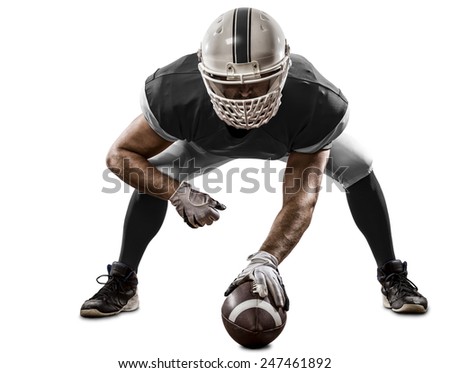 Football Player with a black uniform on the scrimmage line, on a white background.