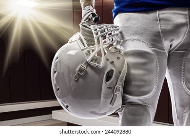 Football Player with a blue uniform on a Locker roon. - Powered by Shutterstock