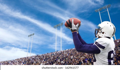 Football Player Catching A Touchdown Pass