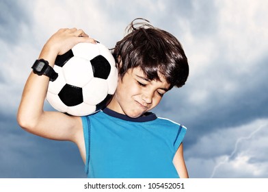 Football Player Celebrate Victory, Cute Boy Playing On Stadium, Kid Enjoying Team Game Outdoor, Teen Holding Catching Ball, Happy Child Facial Expression, Sport Fan Portrait Over Cloudy Sky Background