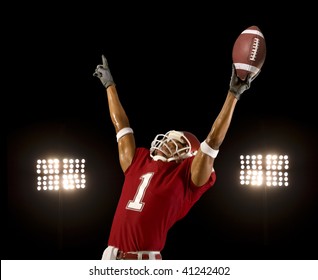 Football player celebrates wining touchdown - Powered by Shutterstock
