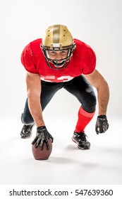 Football Player Crouching In Stance Isolated On Grey