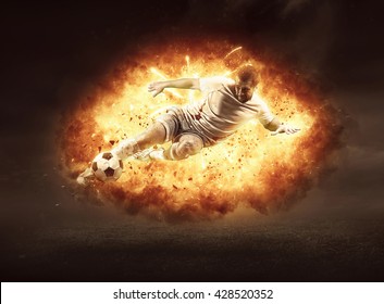 Football Player In Fire Flame On The Outdoor Field