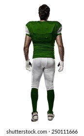 Football Player With A Green Uniform Walking, Showing His Back On A White Background.