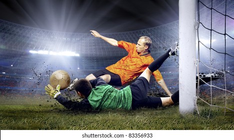 Football player and jump of goalkeeper on the field of stadium at night - Powered by Shutterstock