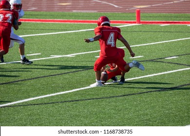 Football Player Kicking A Field Goal