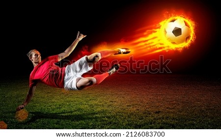 Football player kicks fire ball, 3d rendering