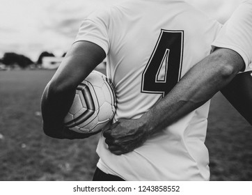 Football Player In A Number 4 Jersey