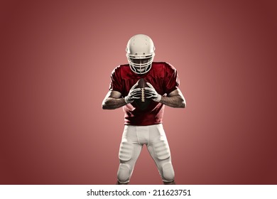 Football Player on a Red uniform, on a red background.