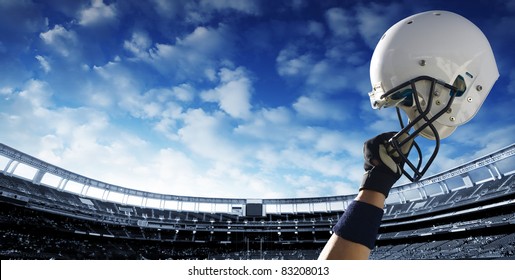 Football Player raises his helmet before an important game