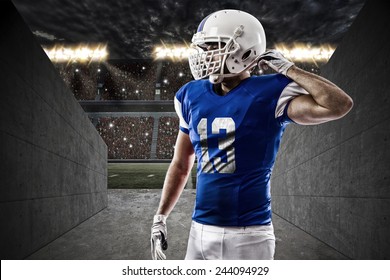 Football Player With A Red Uniform On A Stadium Tunnel.