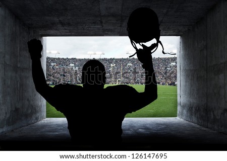 Football Player running out of the Stadium Tunnel