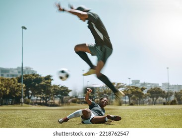 Football Player, Soccer Ball And Field Sport For Fitness Training, Workout And Game For Sports Competition. Athlete Woman And Man Jump To Kick Ball For Tackle, Exercise And Cardio Health On Grass