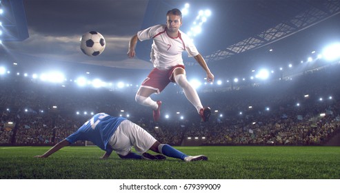 Football Players Tackling For The Ball On A Large Football Stadium Under Dramatic Sky. Player Is Wearing Unbranded Soccer Uniform.