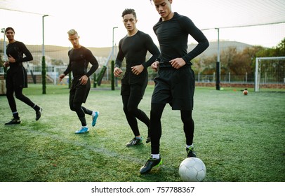 Football Players Training In Soccer Field. Five A Side Soccer Team Practicing During Training Session.