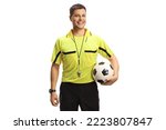 Football referee holding a ball and smiling at camera isolated on white background