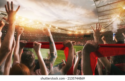 Football scene with cheering audience at the stadium - Shutterstock ID 2135744869
