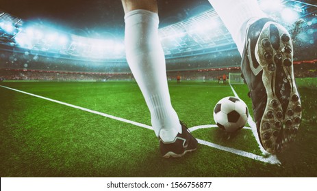 Football scene at night match with close up of a soccer shoe hitting the ball from corner kick - Shutterstock ID 1566756877