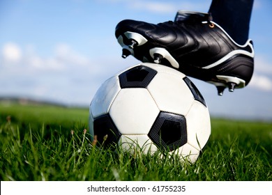 Football or soccer ball at the kickoff of a game - outdoors